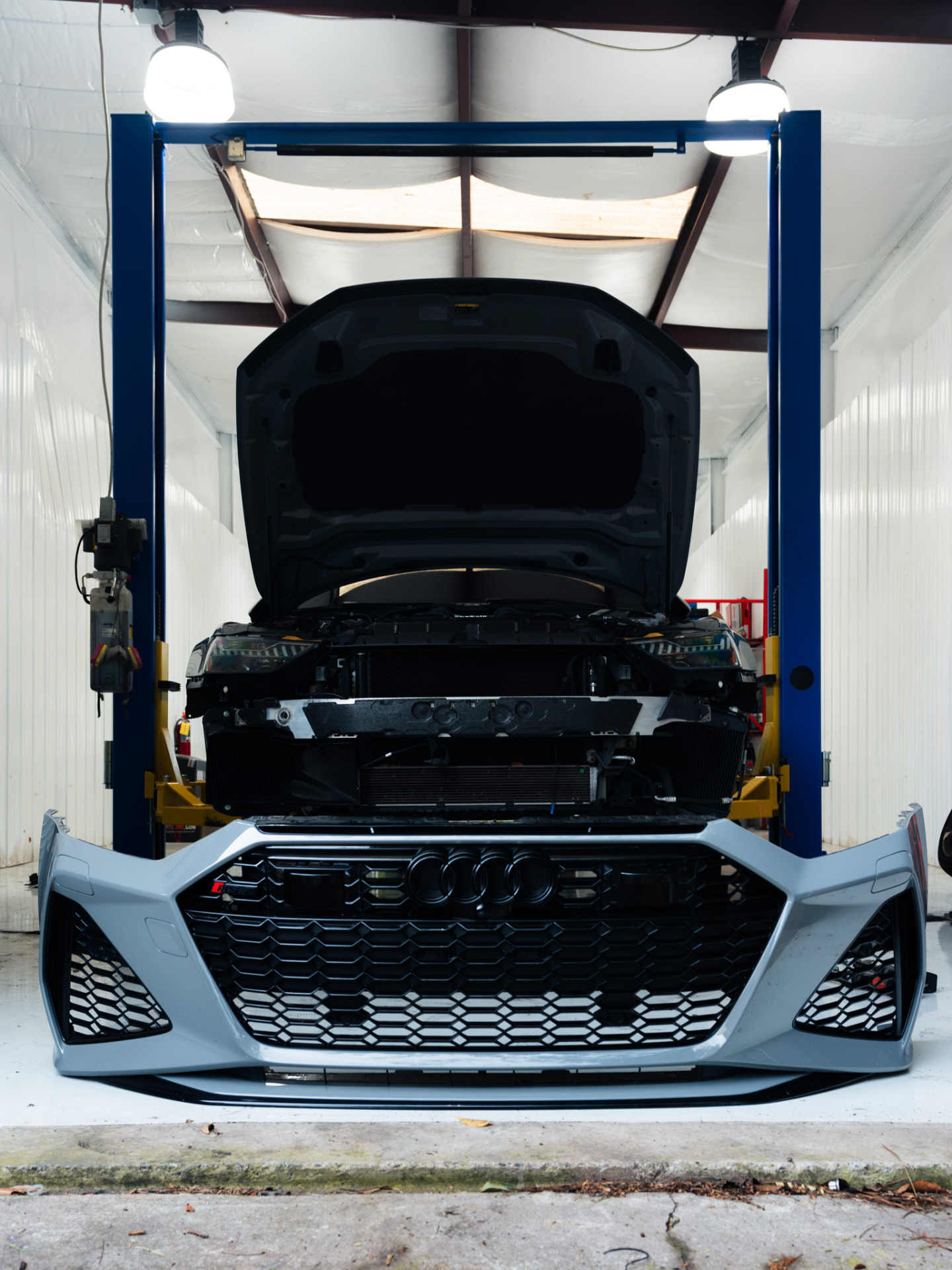 Grey Audi RS7 on the lift inside the Eurocharged Atlanta shop