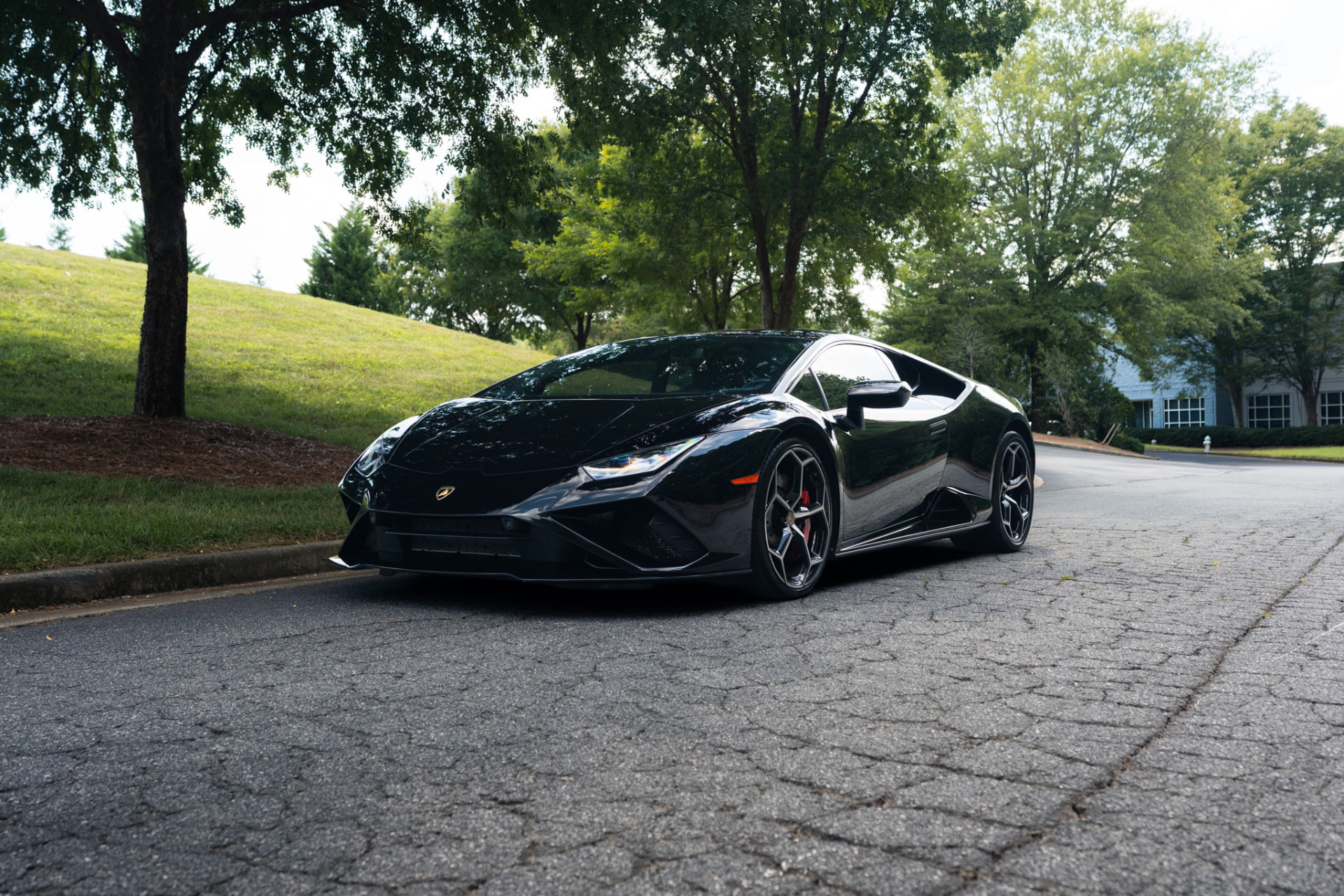 Black Lamborghini Huracán front three-quarter view