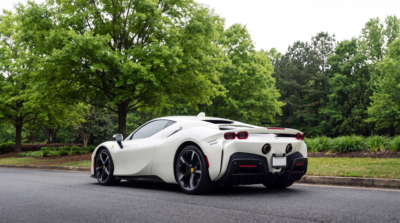 White Ferrari SF90 from the rear three-quarter